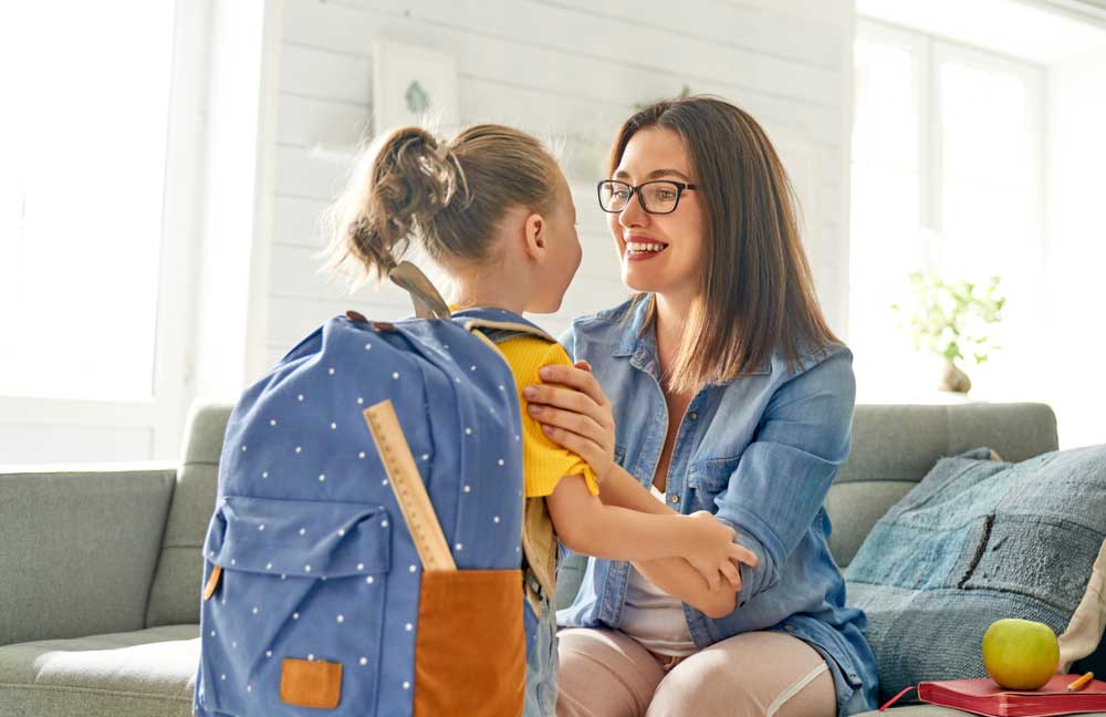 Parent And Child Talking Before Going To Daycare School