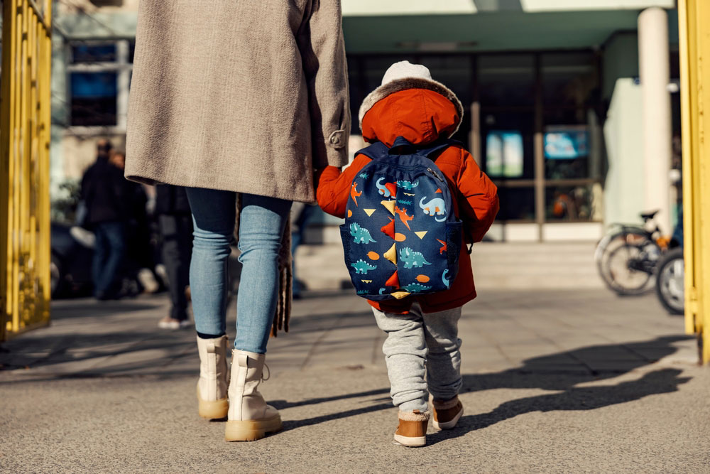 Mother With Her Son To The Childcare Centre