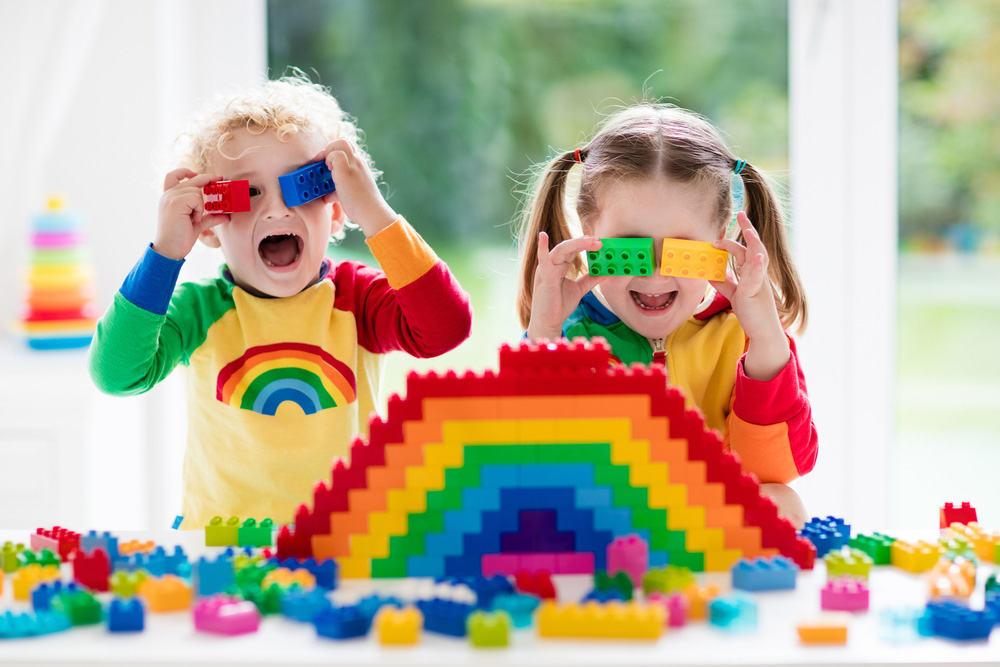Child Playing With Colorful Toys