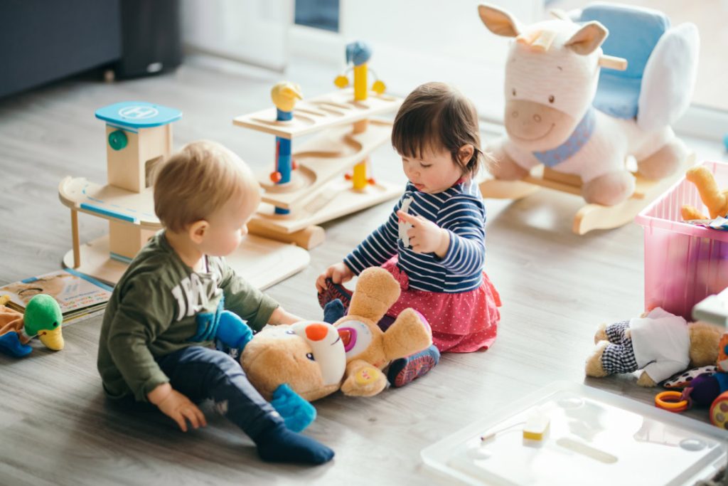 toddlers sharing toys